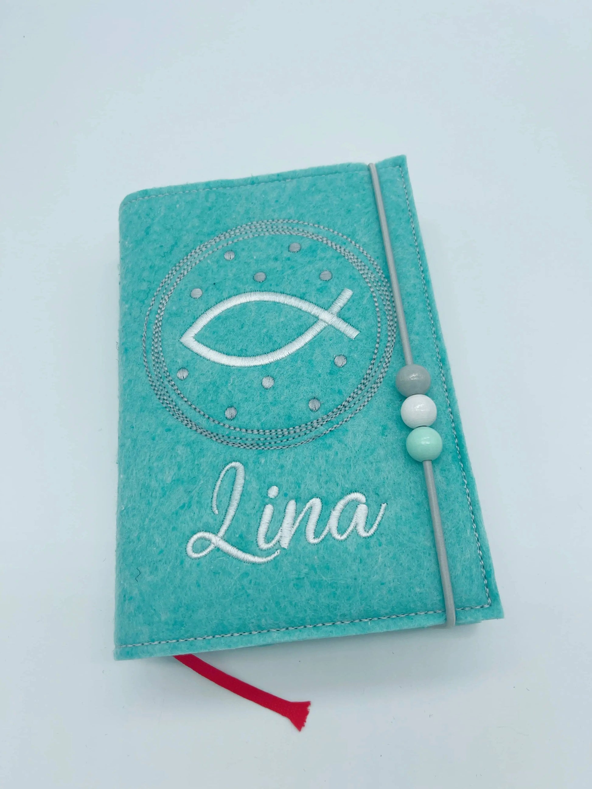 Gotteslobhülle in mintfarbenen Filz bestickt